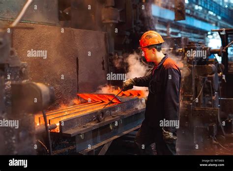 Workers in the steel mill. Metallurgical industry Stock Photo - Alamy