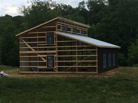 Framing of our pole barn home with clerestory windows across top # ...