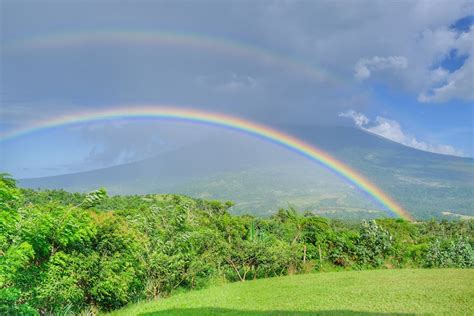 Photo of Rainbow Near Mountain · Free Stock Photo