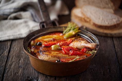 Duck casserole with tomato, olives and crusty bread Recipe · Gressingham