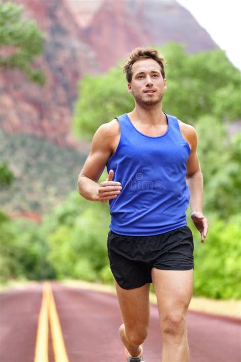 Sport And Fitness Runner Man Running On Road Stock Photo - Image: 53684670