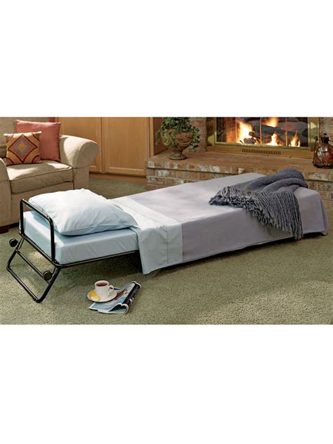 An ottoman by day, but when company arrives, it becomes a comfortable guest bed. They'll ...