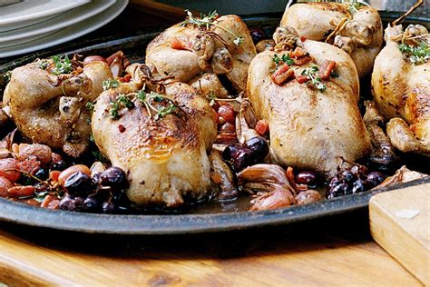 Pot-roasted poussin with pinot, garlic and grapes - Recipes - delicious.com.au