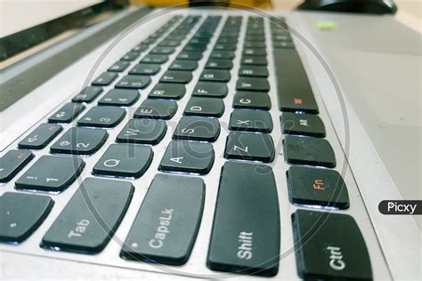 Image of Closeup Side View Of Laptop Keys-AK647586-Picxy