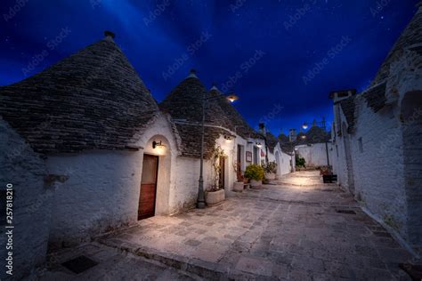 Night view of Alberobello's famous Trulli, the characteristic cone ...