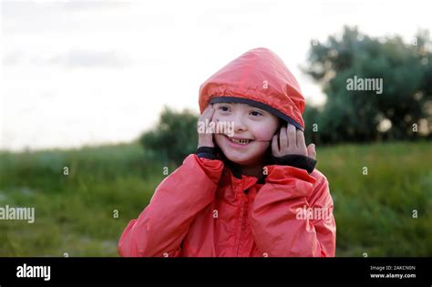 Portrait of little girl smiling outside Stock Photo - Alamy