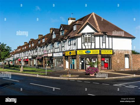 Parade of shops on Banstead village High Street, on a quiet Sunday morning in Surrey, England ...