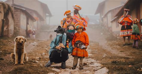 A Journalist Posing with Local People Wearing Traditional Clothing · Free Stock Photo