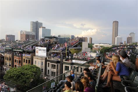 Wrigley Rooftop Owners Sue Chicago Cubs Over New Outfield Signs - WSJ