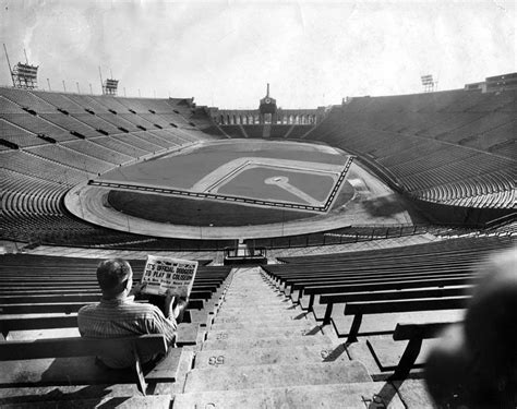 (1958)* - View of the Los Angeles Memorial Coliseum where a man is sitting in the 53rd row. The ...