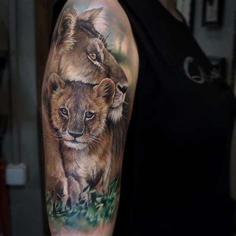 Realisric lion mom and baby tattoo sleeve by @sandradaukshtatattoo ...