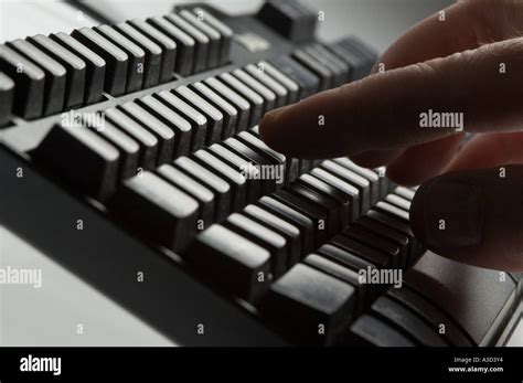 Pressing keys on computer keyboard Stock Photo - Alamy