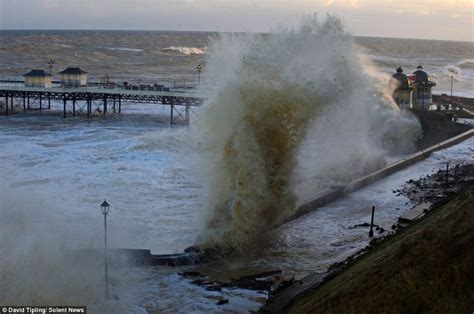 Coastal towns swamped across Britain after worst tidal surge for 60 years sparks evacuation of ...