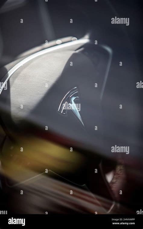 Tesla logo on a steering wheel Stock Photo - Alamy