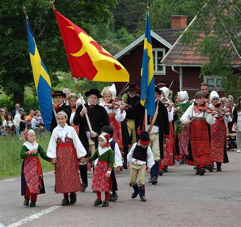 some people are walking down the street with flags