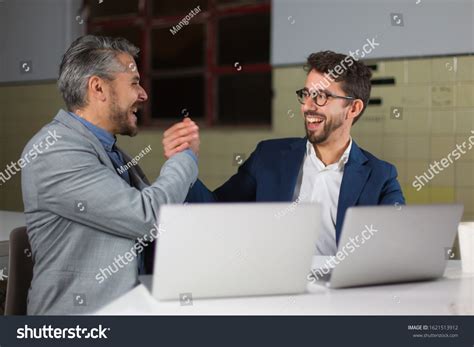 Cheerful Businessmen Shaking Hands Dark Office Stock Photo 1621513912 | Shutterstock