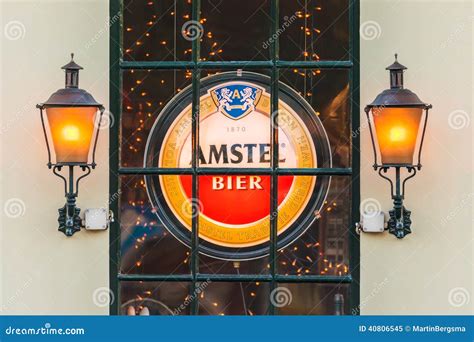 Illuminated Sign with the Dutch Amstel Beer Logo Behind a Window Editorial Image - Image of ...