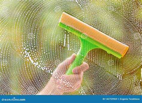 Window Cleaner Using a Squeegee To Wash a Window Stock Image - Image of windows, foam: 142759969