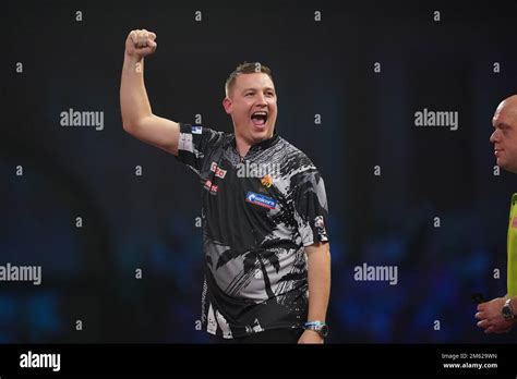 Chris Dobey celebrates victory over Michael van Gerwen during day ...