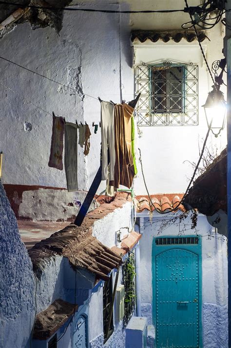 «Chefchaouen Night Scene With Laundry.» del colaborador de Stocksy «Amanda Large» - Stocksy