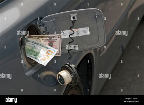 Large sum of cash in diesel truck fuel tank fill spout Stock Photo - Alamy