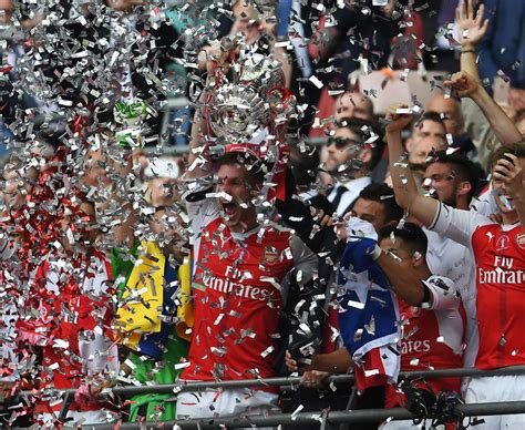 Arsenal lift the 2017 FA Cup trophy at Wembley - Daily Star