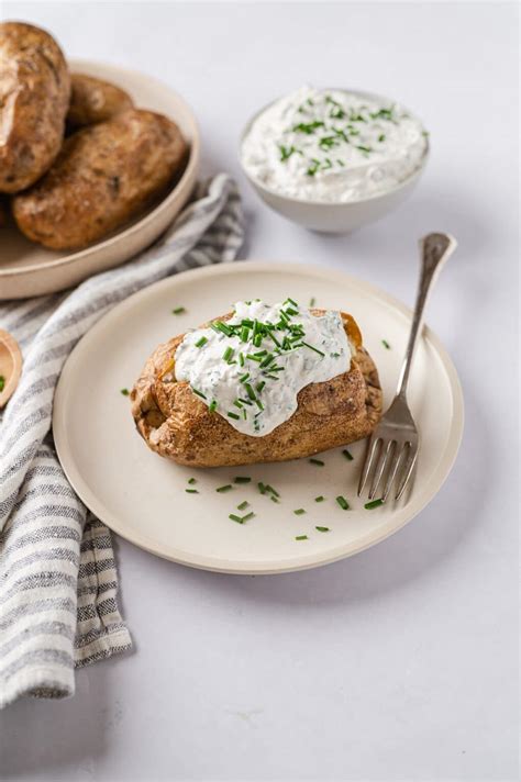 Baked Potatoes with Garlic Herb Sour Cream | Baked Bree