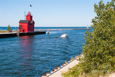 Red Lighthouse Amd Breakwater In Holland State Park Michigan Photograph by Robert Ford