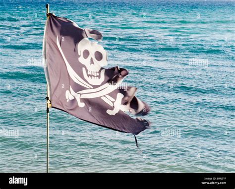 Tattered pirate flag Stock Photo - Alamy