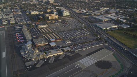 4.8K stock footage aerial video of runways at Burbank Airport and suburban neighborhoods at ...