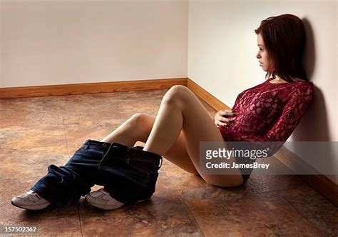 Woman Sitting In Corner Photos and Premium High Res Pictures - Getty Images