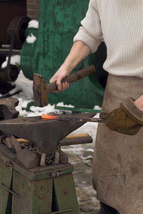 "Blacksmith Working With Hammer" by Stocksy Contributor "Danil Nevsky" - Stocksy