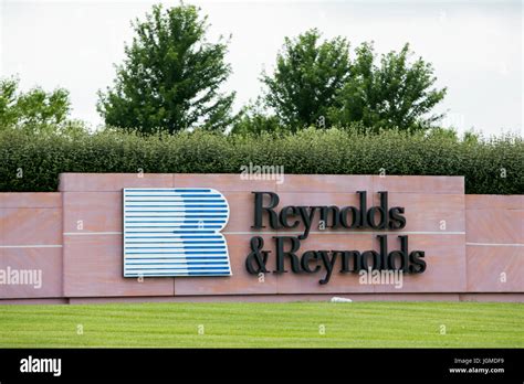 A logo sign outside of the headquarters of The Reynolds and Reynolds ...