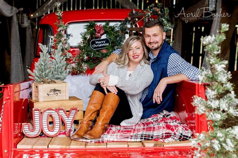 Couple Christmas Mini Session in the bed of an old vintage red chevy ...