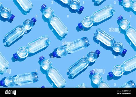 Mineral water bottles on blue background Stock Photo - Alamy