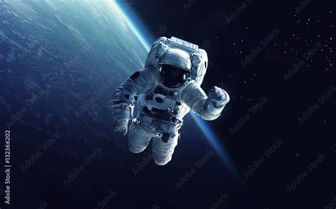 Astronaut at spacewalk. Cosmic art, science fiction wallpaper. Beauty ...