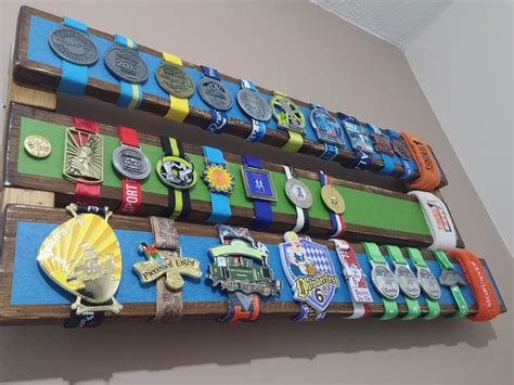 Took some inspiration from etsy models and created my own medal display that solves the problem ...