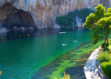 Lake Vouliagmeni is a mysterious and atmospheric place to visit for swimming and a coffee too ...