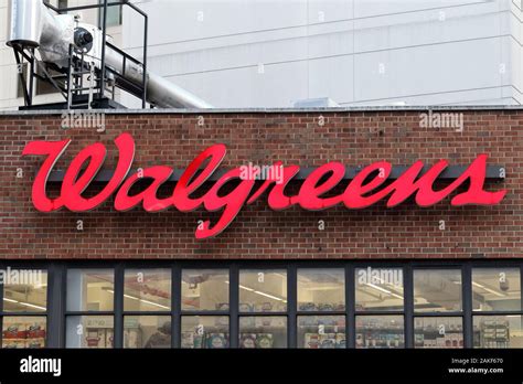 The Walgreens logo against a brick wall background on their store in ...