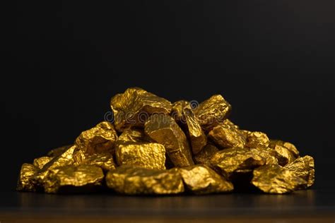 A Pile of Gold Nuggets or Gold Ore on Black Background, Precious Stock Photo - Image of rock ...