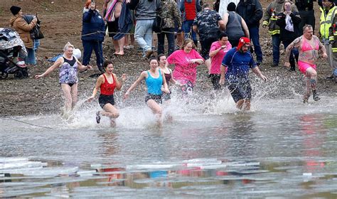 Polar Bear Dip participants welcome 2023 with chilly plunge into ...