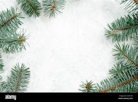 Christmas frame made of branches of a New Year tree. Christmas wallpaper. Flat lay, top view ...