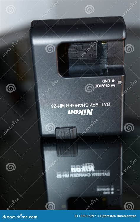 Nikon battery charger with editorial photography. Image of accessories - 196952397