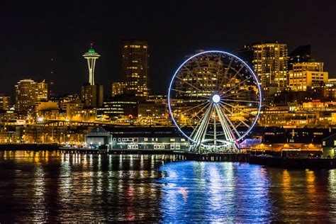 The Seattle Great Wheel and Space Needle on the Waterfront at Night ...