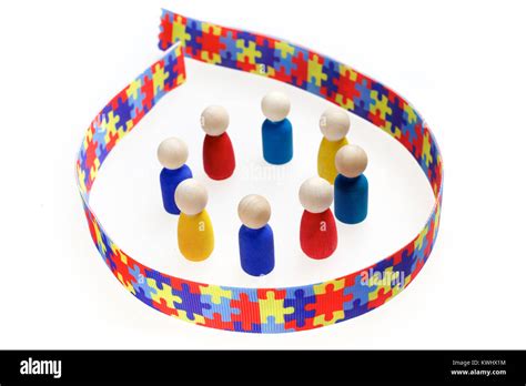 Autism inscription with figures and Puzzle pattern ribbon on a white Stock Photo - Alamy