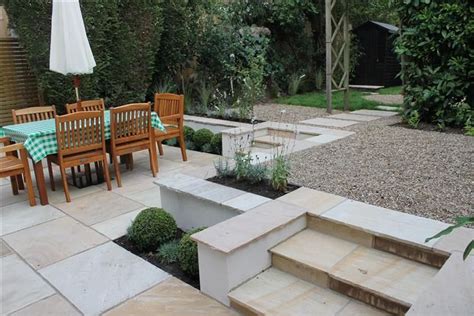 Low budget good looking garden in South London, using sandstone, easy planting and pea shingle ...