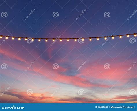 Light Bulbs on String Wire Against Sunset Sky Stock Photo - Image of beach, celebration: 66541082