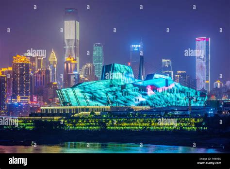 CHONGQING, CHINA - SEPTEMBER 23: View of the Chongqing Grand Theatre building and city skyline ...