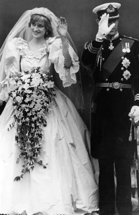 a man and woman in wedding attire standing next to each other