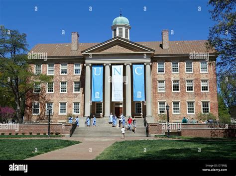 University of North Carolina, Chapel Hill, UNC. Students in graduation gowns on the steps of the ...